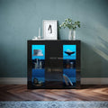 Le charme du rangement avec ce buffet avec portes, avec elements vitres, coloris noir et vert